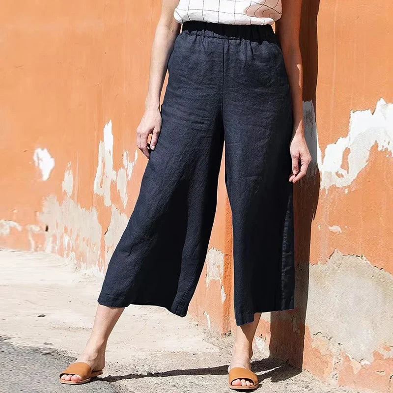Linen cropped wide-leg drawstring trousers for women, loose pull-on style, lightweight and comfortable for casual wear.