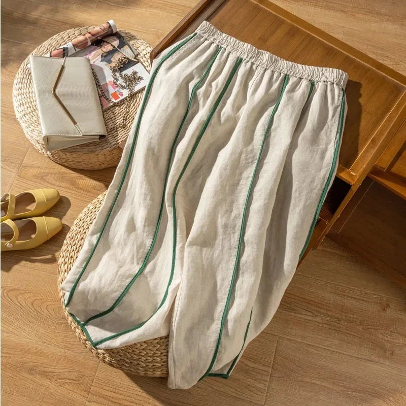 Women’s linen wide-leg elastic-waist trousers with a loose fit, pull-on design, and relaxed style in a natural linen fabric.
