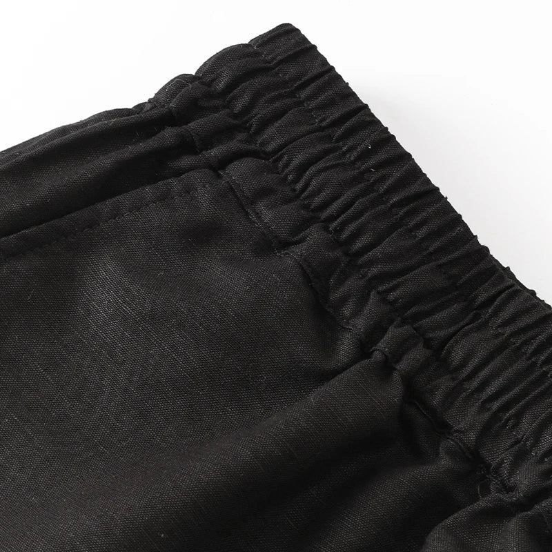 Light beige cotton linen wide-leg drawstring trousers for women, loose pull-on pants with a relaxed fit.