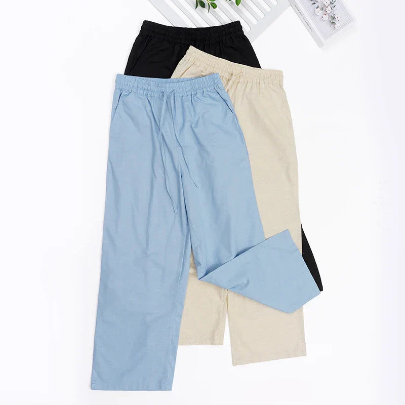 Light beige cotton linen wide-leg women’s drawstring trousers with a loose fit and pull-on design, perfect for casual comfort.