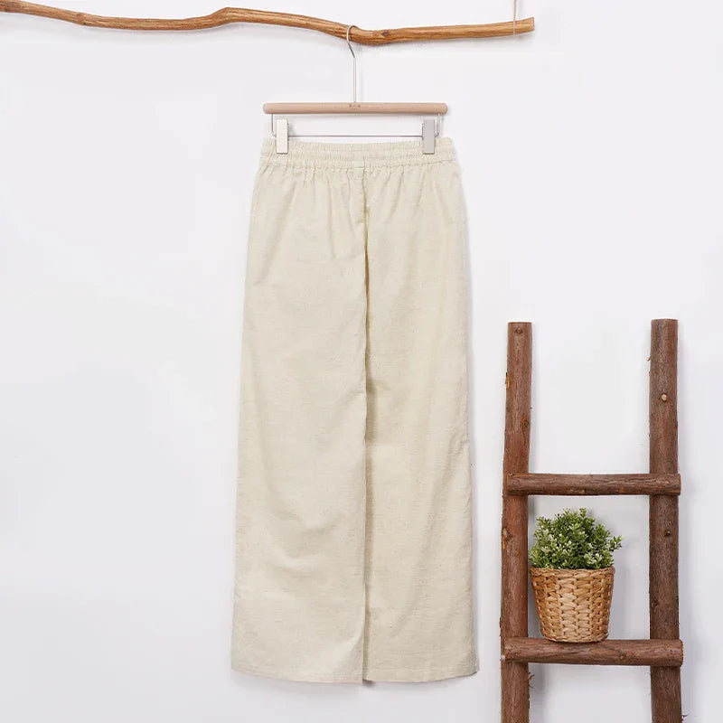Women’s cotton linen wide-leg drawstring trousers with a loose fit and pull-on style, perfect for casual and comfortable wear.