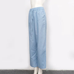 Women’s cotton linen wide-leg drawstring trousers with a loose fit and pull-on design, ideal for casual and comfortable style.