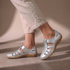 Silver cutout fisherman sandals for women by Tammy Bradley, featuring open toe design and adjustable straps.
