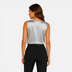 Elegant women's satin sleeveless blouse with a V-neck, silky texture, perfect for stylish and sophisticated looks.