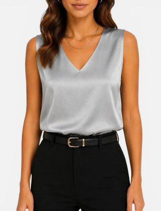 Elegant women's sleeveless satin blouse with V-neck, silky fabric, perfect for stylish occasions.