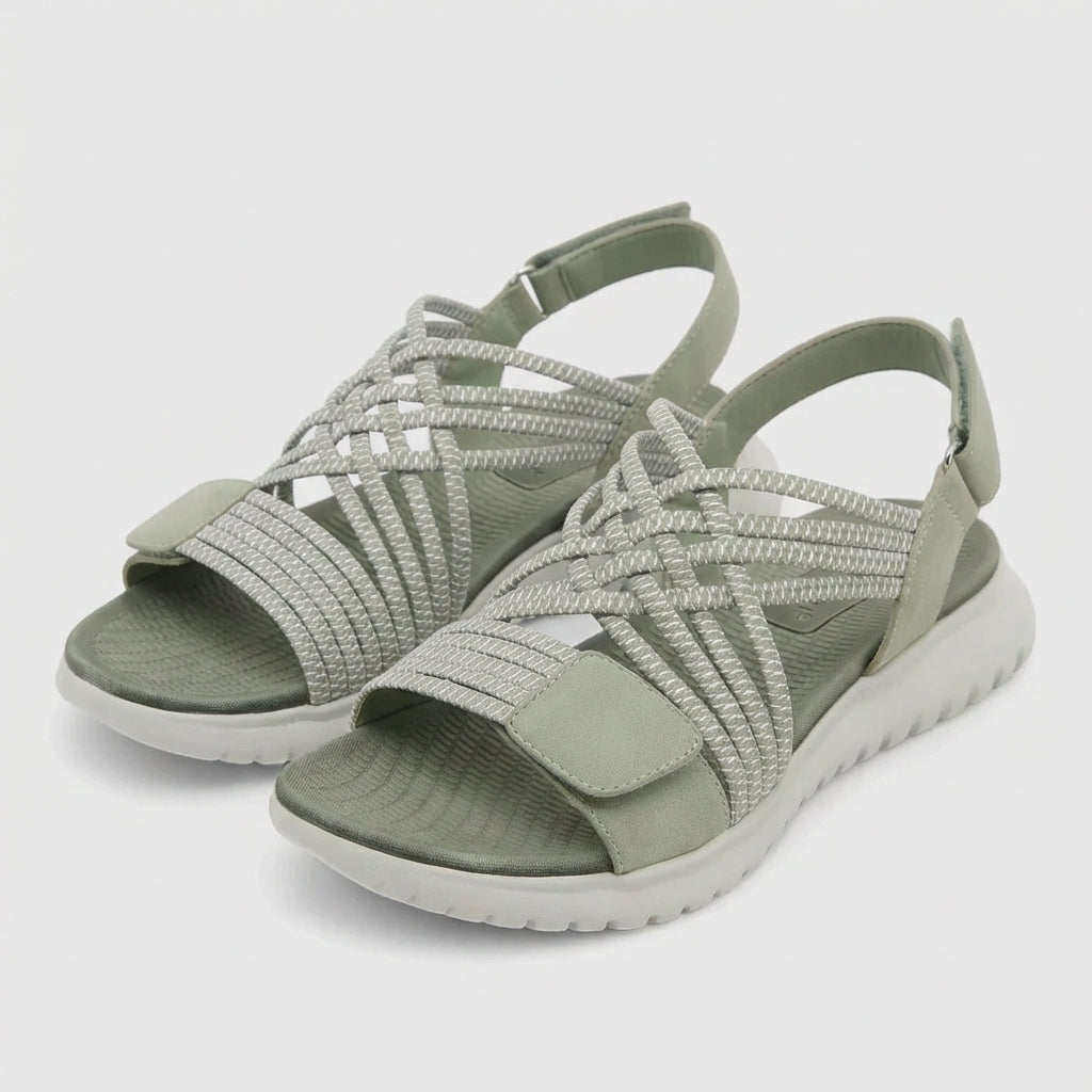 Orthopedic criss-cross strappy women's sandals with adjustable fit, featuring supportive straps and cushioned soles for comfort.