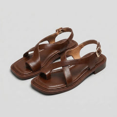 Square-toe block-heel criss-cross sandals for women by Tammy Bradley, featuring stylish design and comfortable fit.