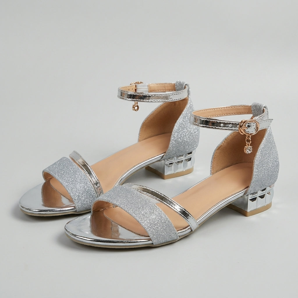 Tammy Bradley metallic block-heel ankle-strap sandals for women, featuring a stylish design and open-toe style in a studio setting.