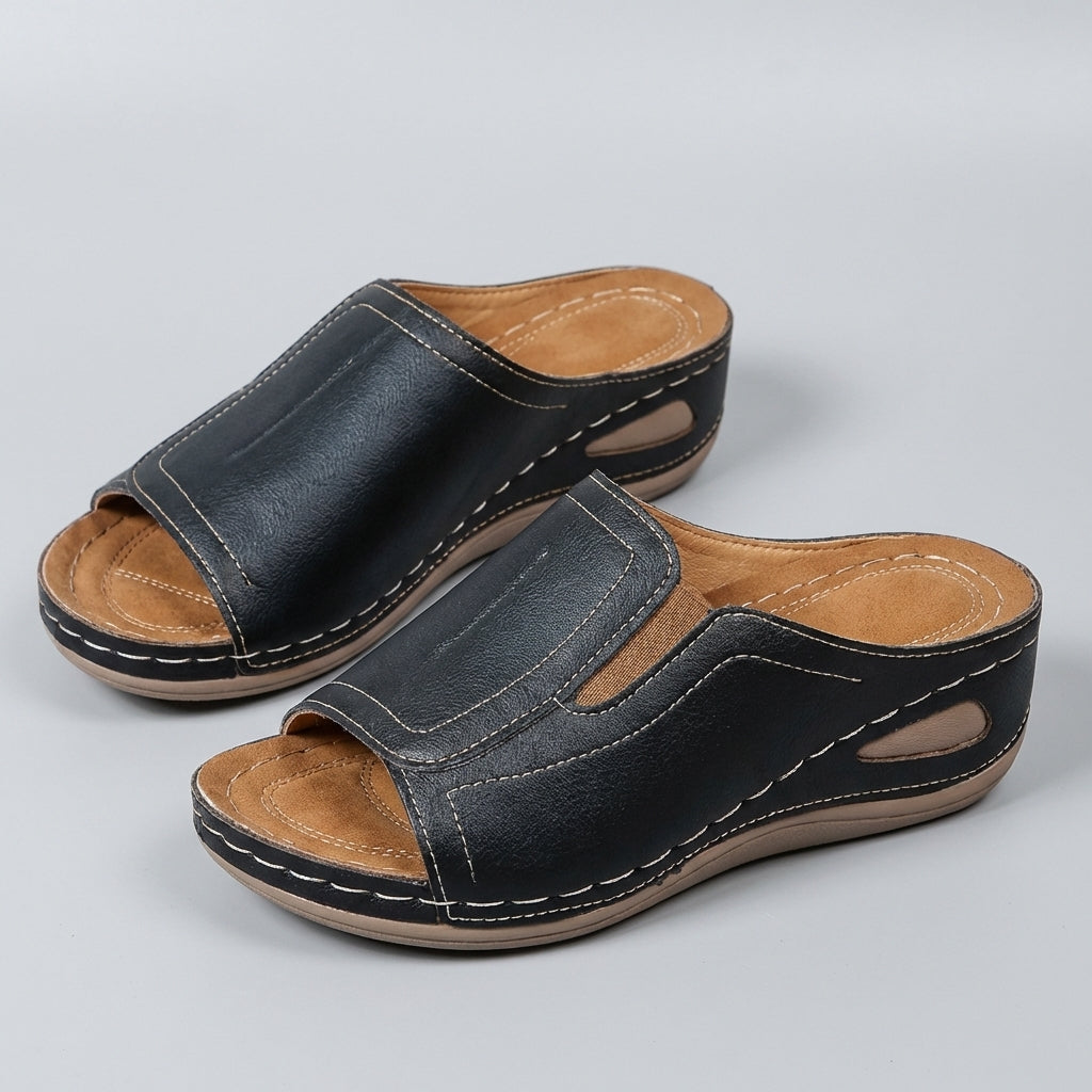 Open-toe orthopedic wedge slide sandals for women in neutral tones, featuring supportive footbed and casual style.