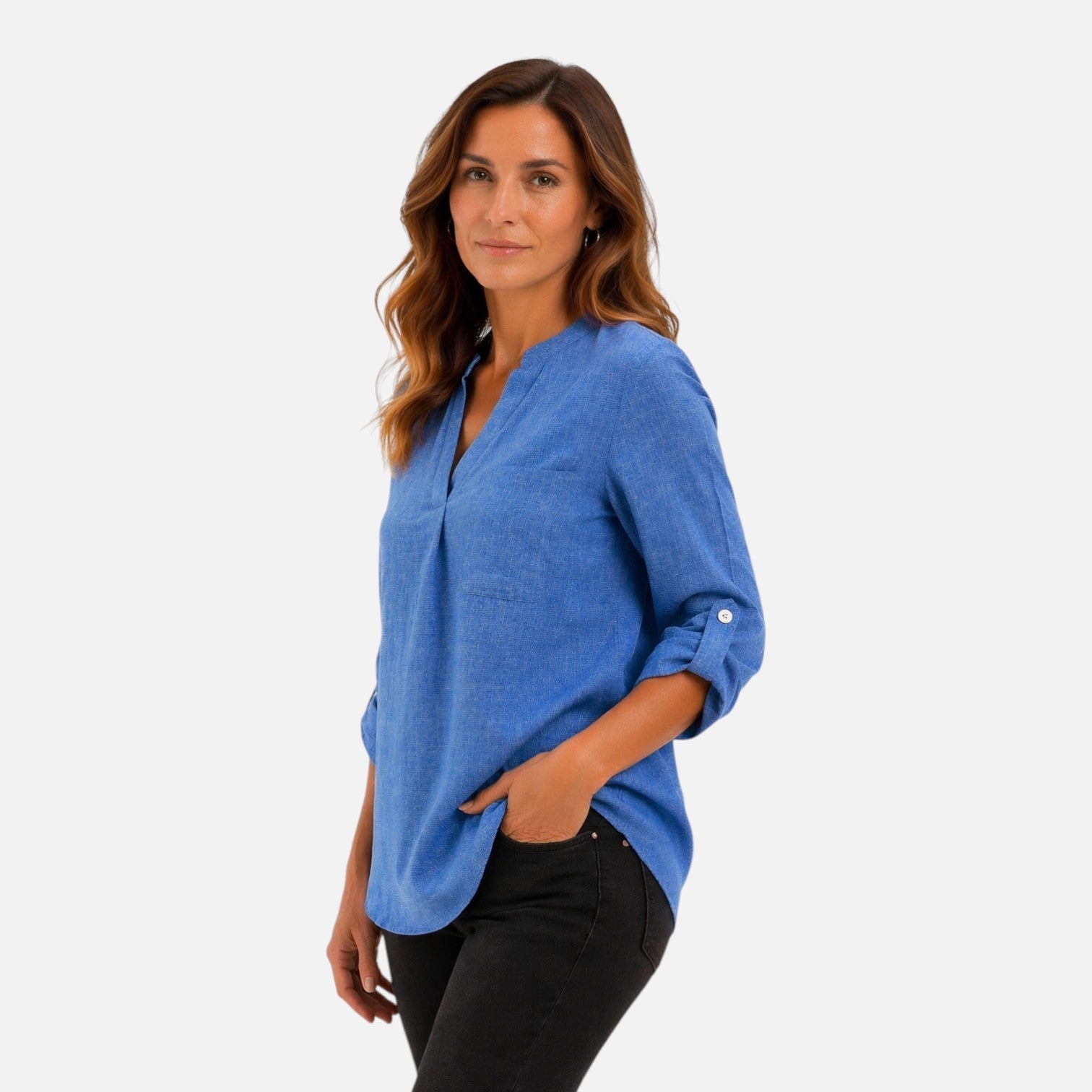 Elegant women's blue V-neck long sleeve blouse, casual dressy top, styled as a studio portrait of a woman.
