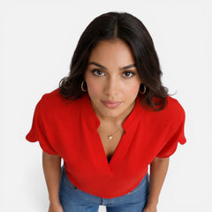 Lightweight women's chiffon blouse with a V-neck, casual summer top in soft fabric, perfect for warm weather.