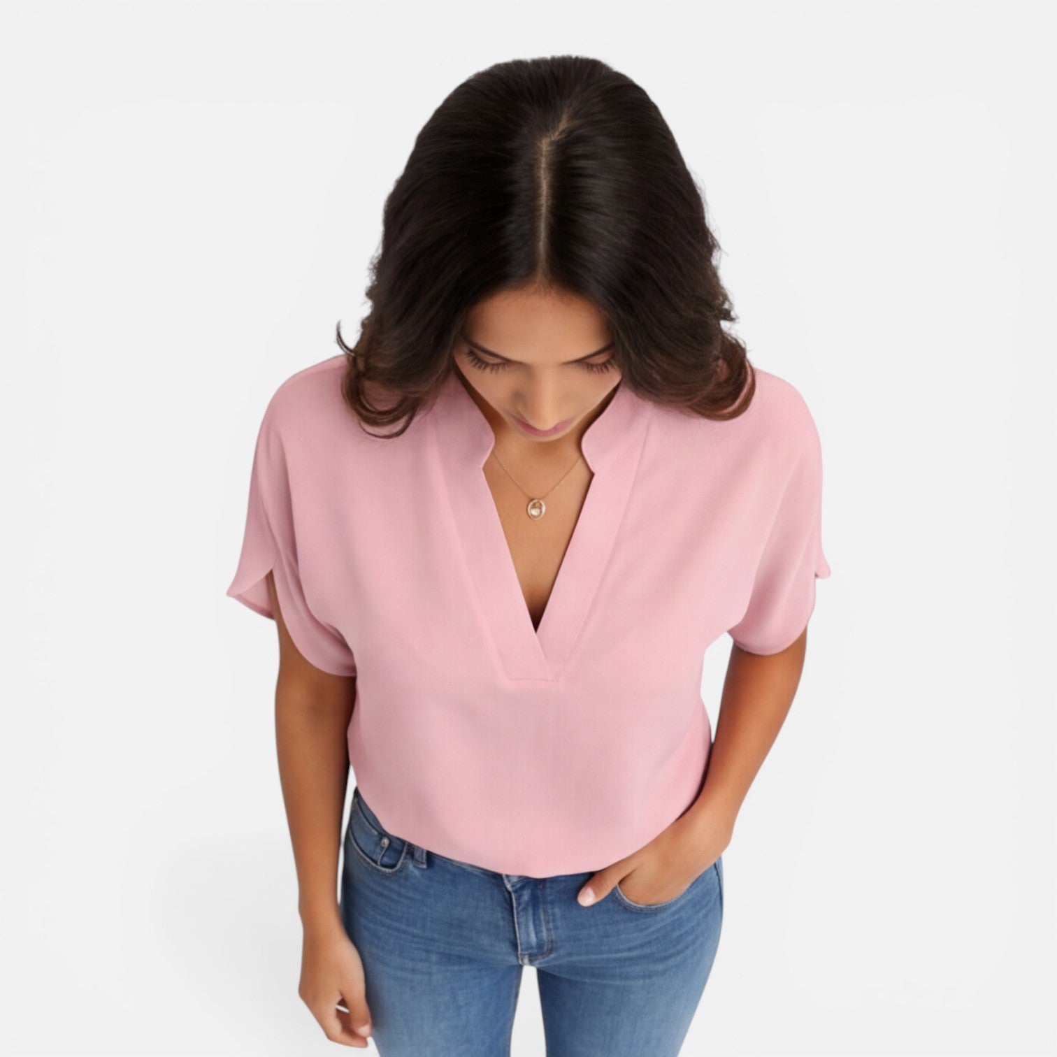 Lightweight women's chiffon blouse with V-neck, casual summer top in soft, flowing fabric suitable for warm weather.