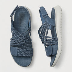Women's orthopedic criss-cross strappy sandals with adjustable straps, featuring supportive design and side view details.