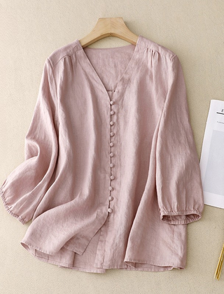 Light beige V-neck linen blouse for women, featuring a relaxed fit and short sleeves, perfect for summer wear.