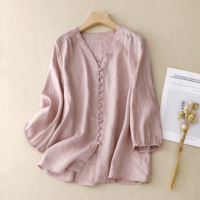 Light beige V-neck linen blouse for women, featuring a relaxed fit and short sleeves, perfect for summer wear.