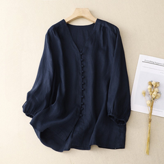 V-neck linen summer blouse for women featuring lightweight fabric and relaxed fit, ideal for warm weather.