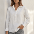 White linen V-neck relaxed-fit women's popover shirt by Tammy Bradley, featuring a loose, comfortable fit and classic design.