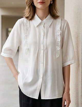 White denim ruffle summer blouse for women, stylish top with feminine ruffle details, perfect for warm weather.
