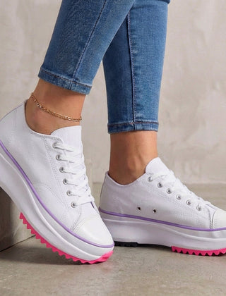 White orthopedic women's sneakers with lace-up design, providing comfortable support and stylish look.