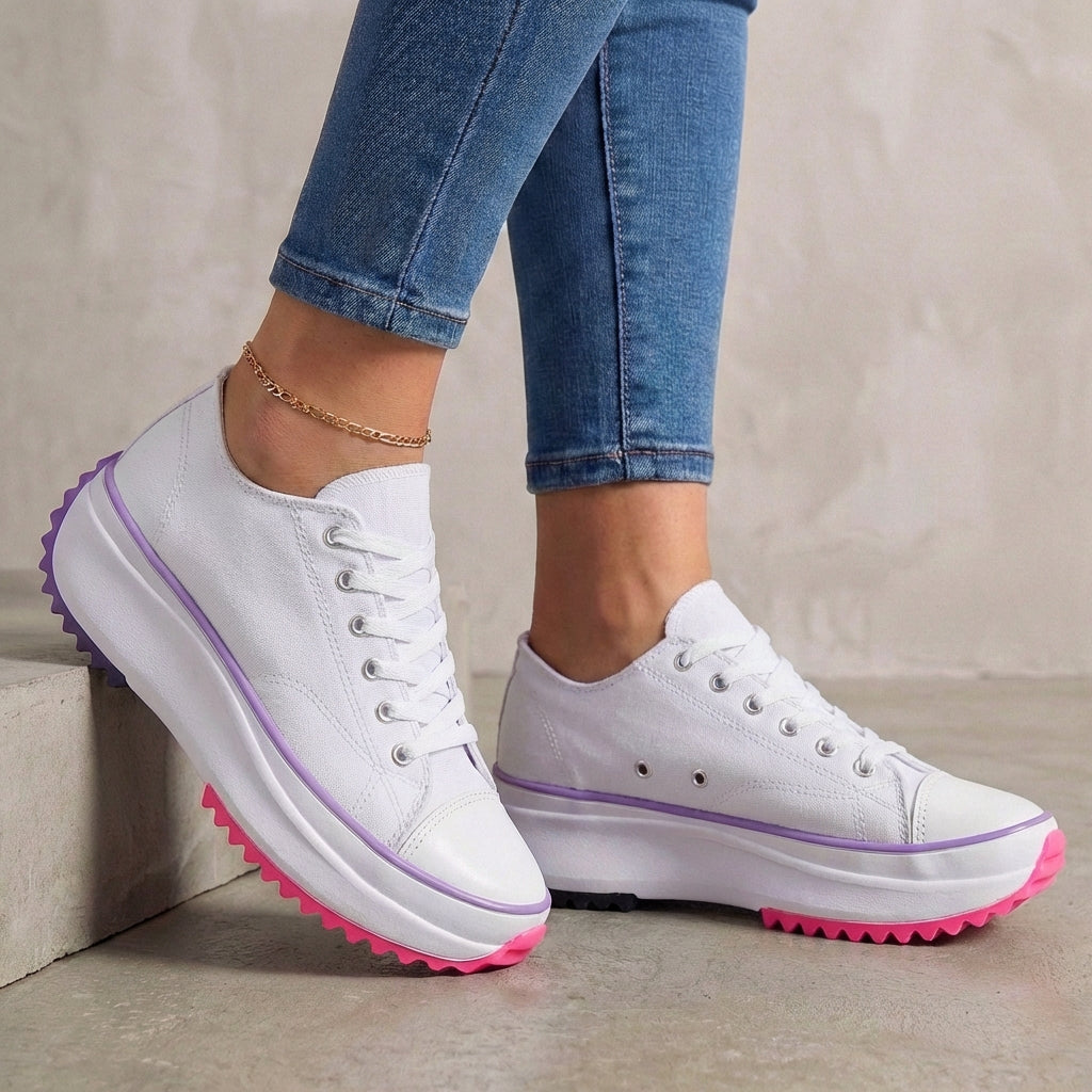 White orthopedic women's sneakers with lace-up design, providing comfortable support and stylish look.