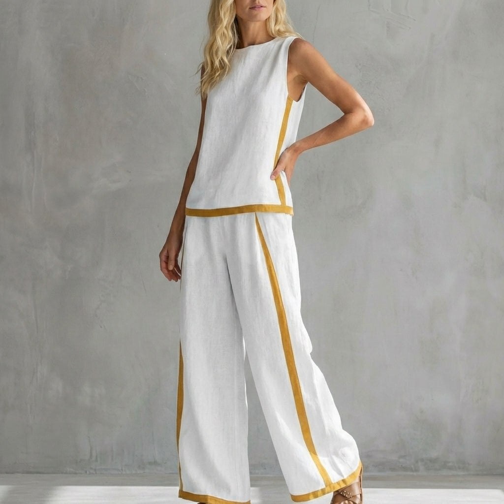 White women's two-piece slit co-ord set by Tammy Bradley, featuring a stylish top and matching pants, on a plain background.