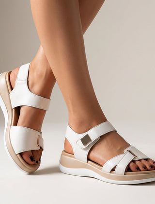 White orthopedic platform strap sandals with buckle detail, featuring supportive design and casual style.