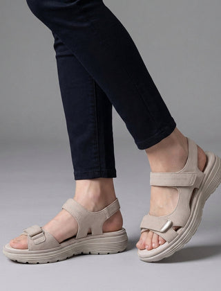 White orthopedic comfort fit sandals with chunky sole and adjustable straps, designed for support and casual wear.