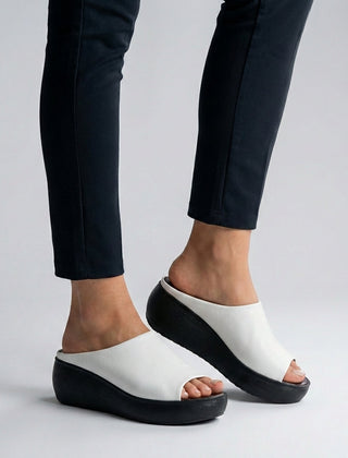 White Tammy Bradley platform slide sandals for women with open toe design and chunky sole, perfect for casual summer wear.