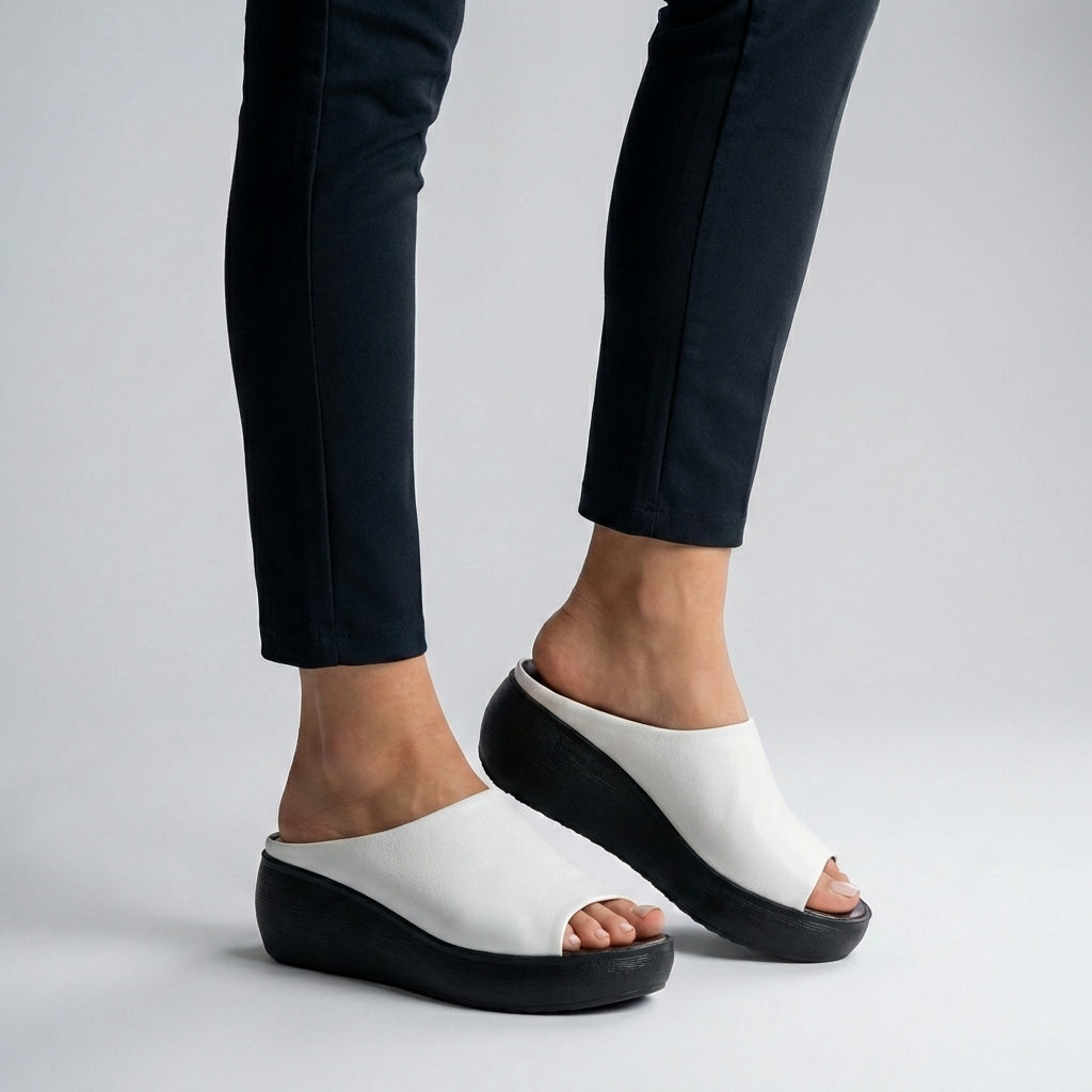 White Tammy Bradley platform slide sandals for women with open toe design and chunky sole, perfect for casual summer wear.