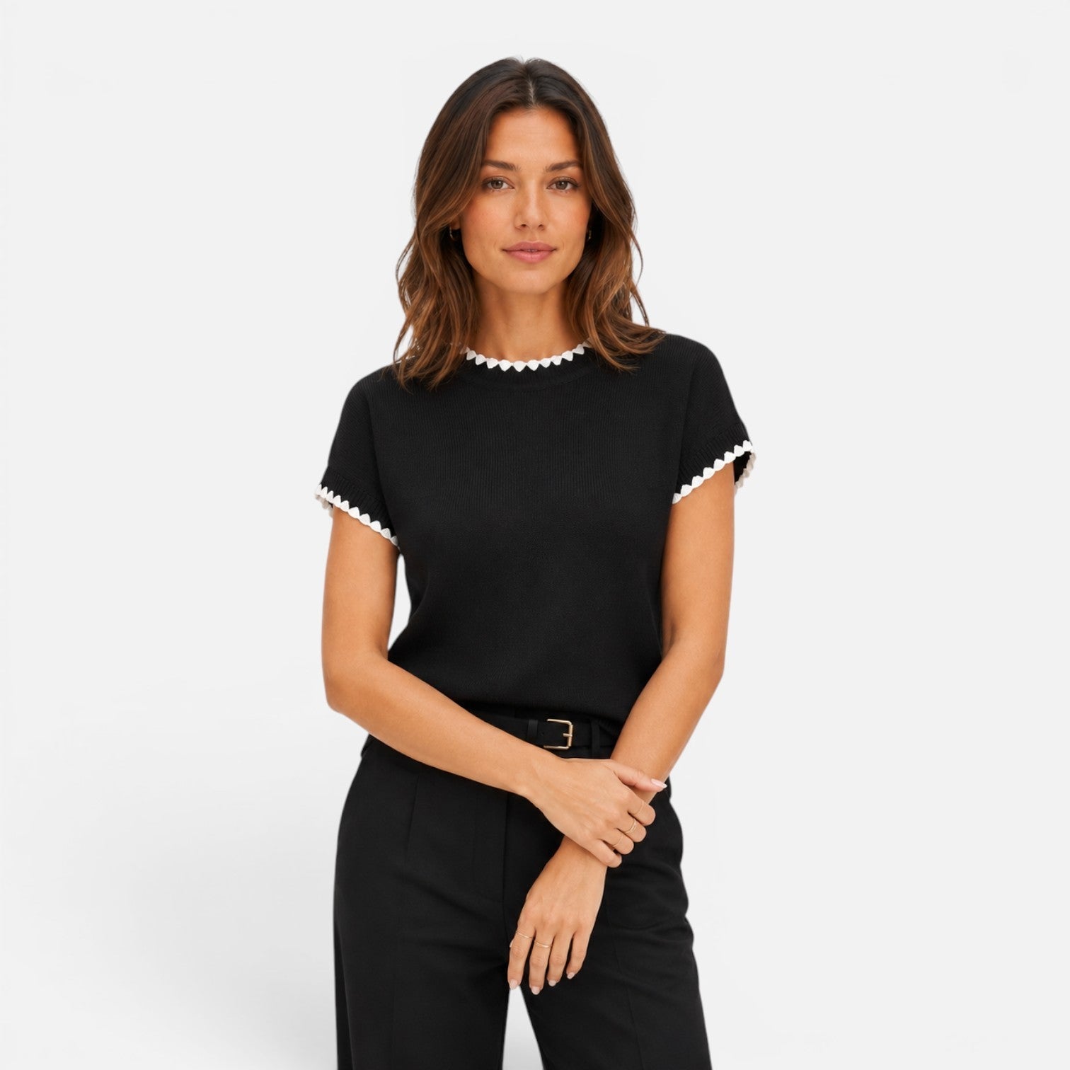 Women's knit top with contrast trim, short sleeve crew neck, stylish women's shirt featuring a comfortable fit and modern design.