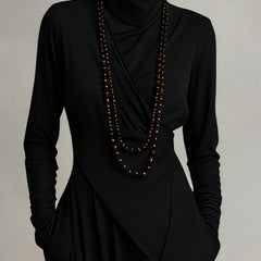 Elegant women's summer maxi dress with high neck and long sleeves in soft fabric, perfect for warm weather and casual occasions.