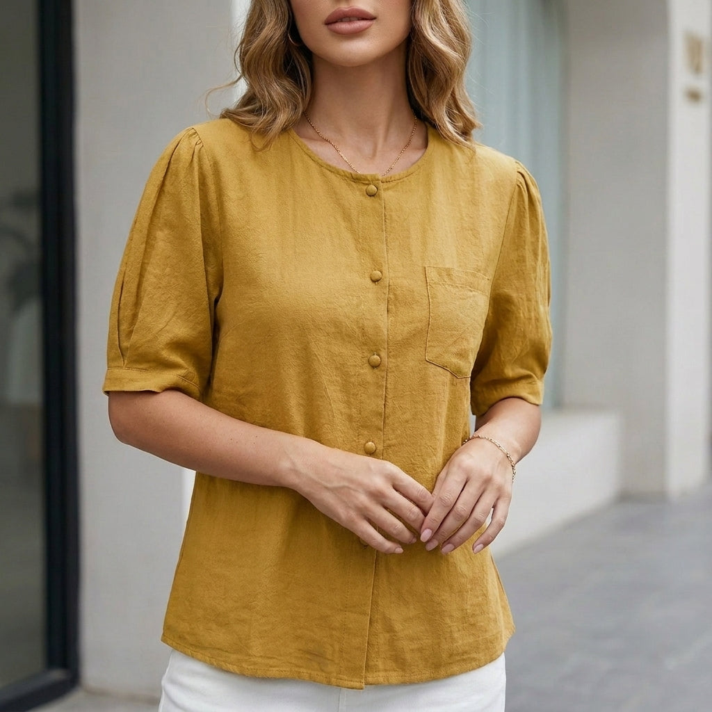 Yellow women's summer blouse with short sleeves, linen fabric, and front pockets, perfect for casual warm-weather wear.