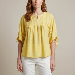 Yellow linen flowy summer blouse for women, stylish lightweight top perfect for warm weather and casual wear.