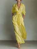 Yellow linen maxi dress for women by Tammy Bradley showing a flowy, sleeveless design with a V-neck and ankle-length silhouette.