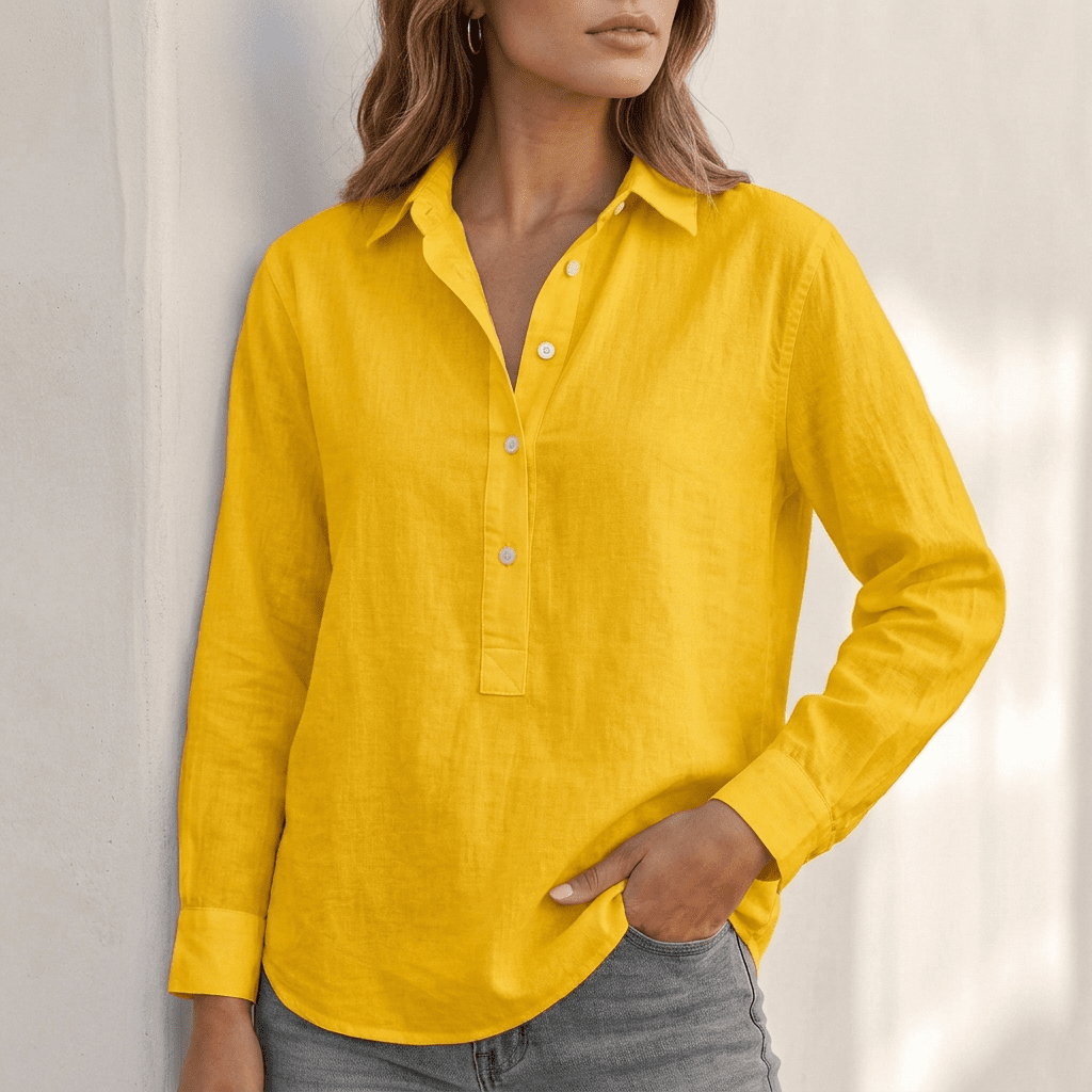 White linen v-neck relaxed-fit popover shirt for women by Tammy Bradley, shown on a model with a casual, breezy style.