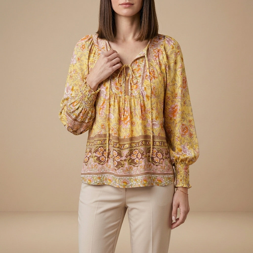 Yellow floral long sleeve linen blouse for women, lightweight summer top with a relaxed fit and feminine design.