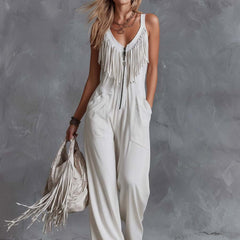 White faux suede Western fringe V-neck jumpsuit for women, featuring stylish fringe details and a V-neck design.