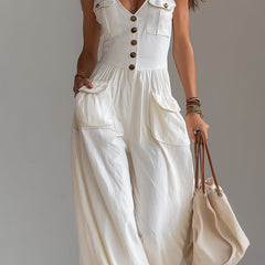 White sleeveless wide-leg jumpsuit with patch pockets for women, featuring a stylish and comfortable design.