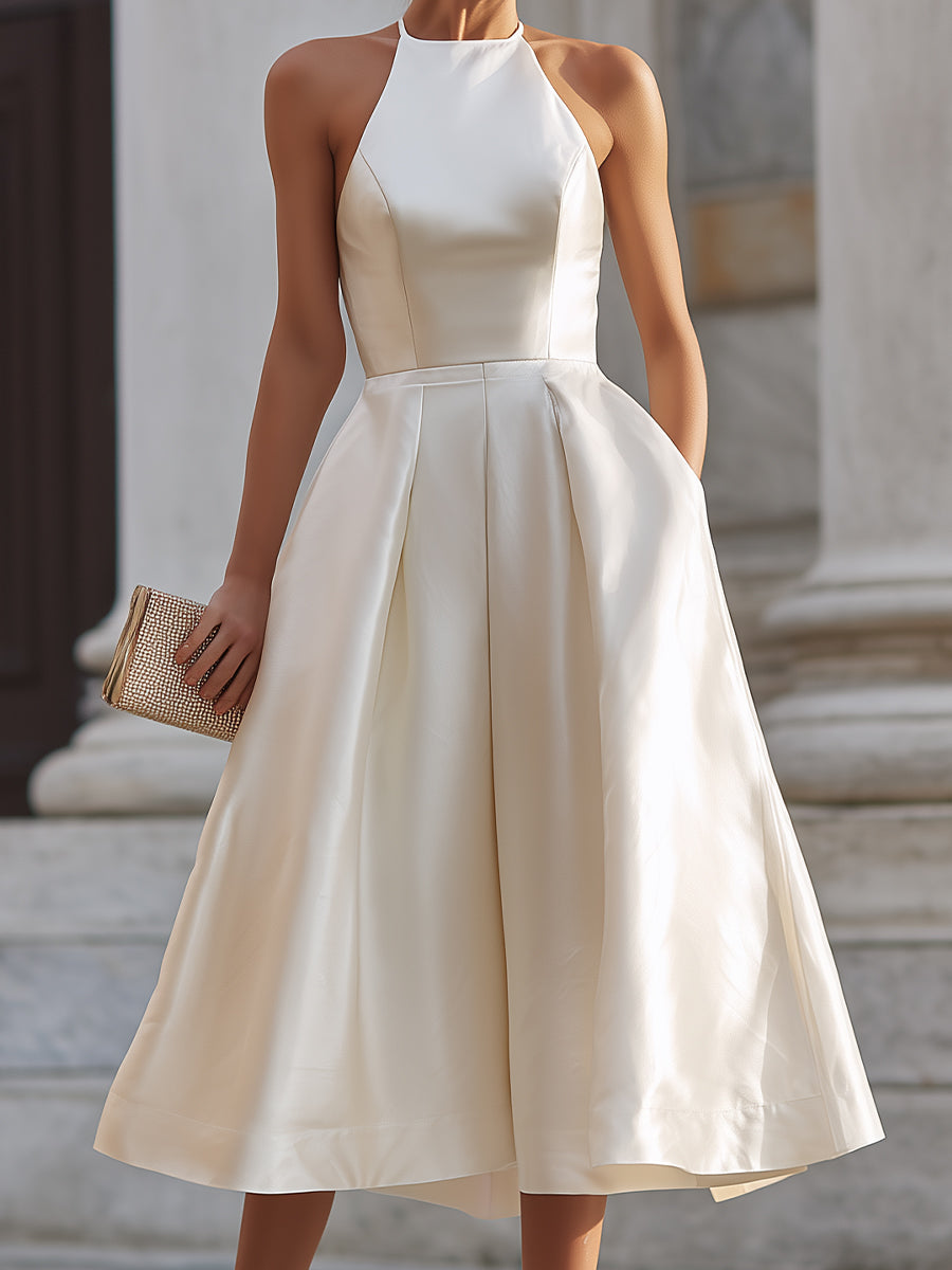 Elegant halter-neck pleated midi dress for women, featuring flowing fabric and a stylish design, perfect for occasions.
