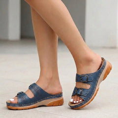 Blue Tammy Bradley buckle platform slide sandals for women, featuring a stylish design with a comfortable sole.
