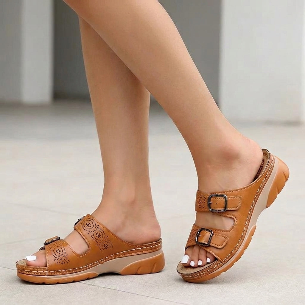 Brown Tammy Bradley buckle platform slide sandals for women with wide straps and chunky soles.