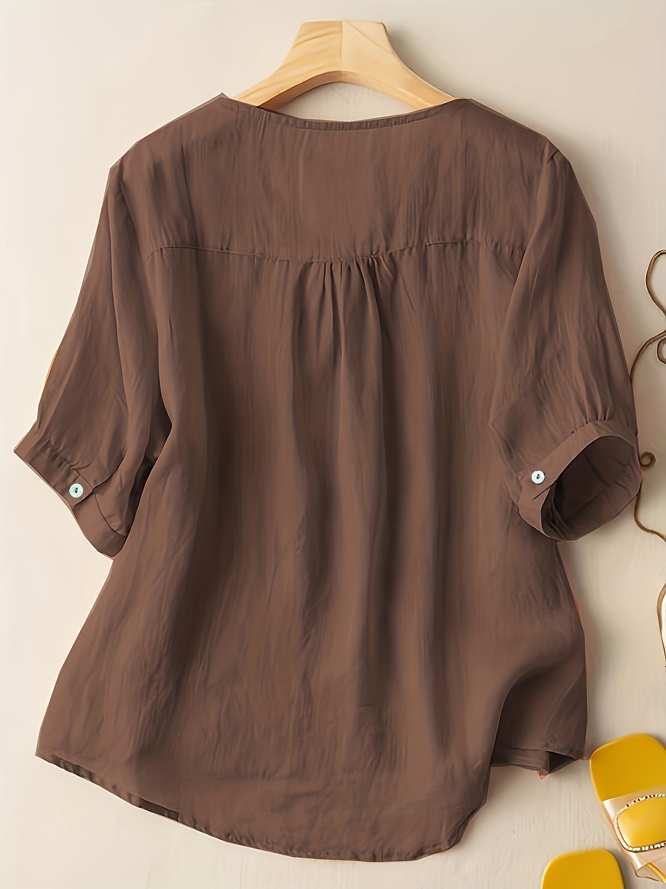Light beige V-neck linen summer blouse for women, flowy and casual, perfect for warm weather and relaxed styles.