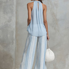Light blue striped chiffon wide-leg women's pants with a relaxed fit, featuring a flowy and elegant design.