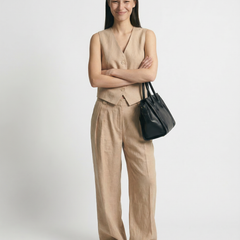 White women's wide leg linen trousers with high waist and relaxed fit, perfect for casual or chic summer outfits.