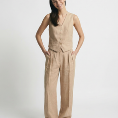 Women's high waist white linen trousers with wide leg design, casual and breezy pants for warm weather.