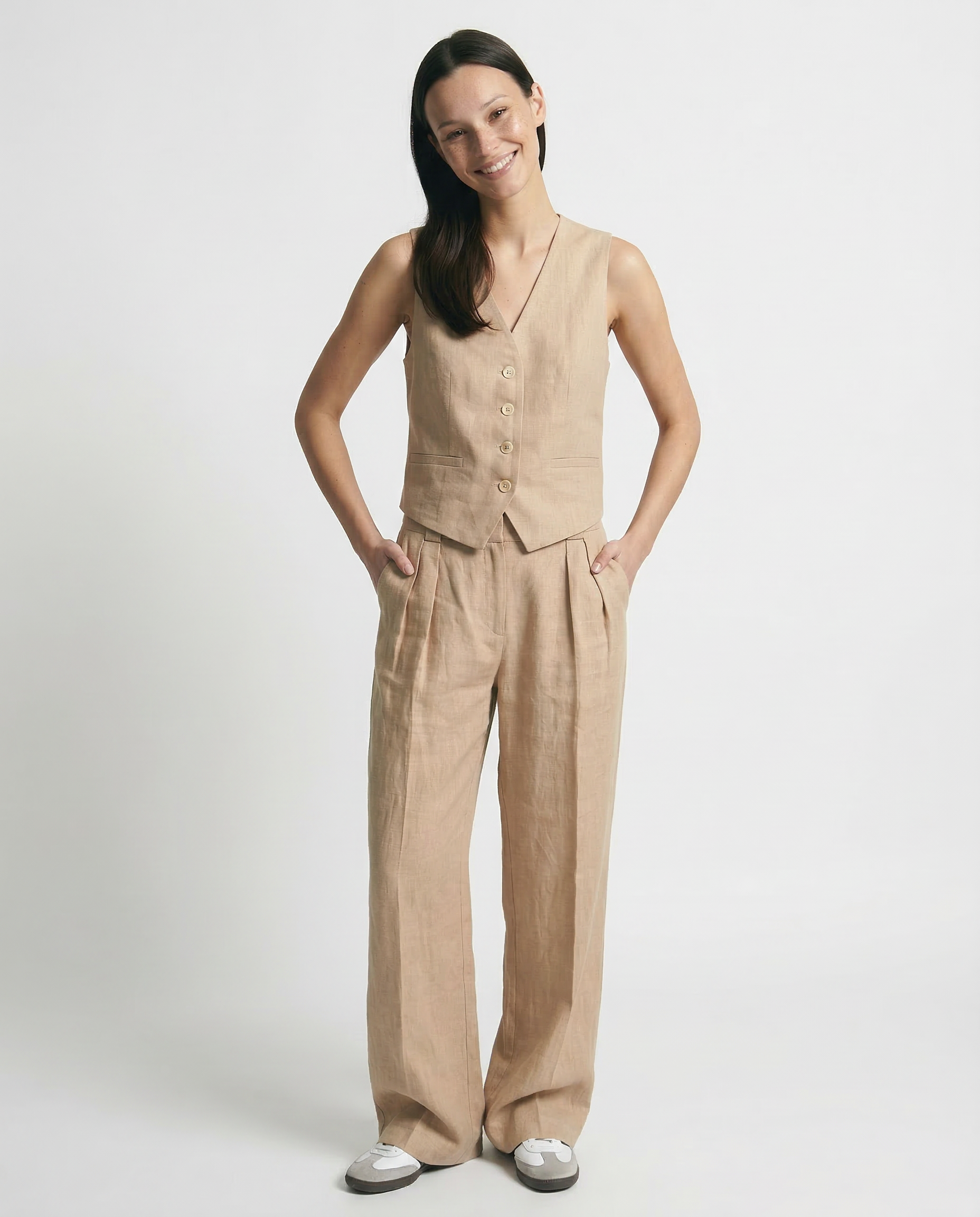 Women's high waist white linen trousers with wide leg design, casual and breezy pants for warm weather.