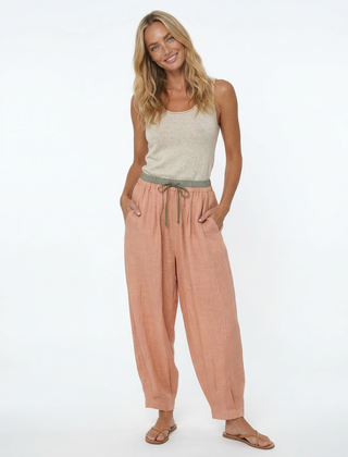 Beige tapered linen trousers for women, loose pull-on style, comfortable casual pants, perfect for everyday wear.