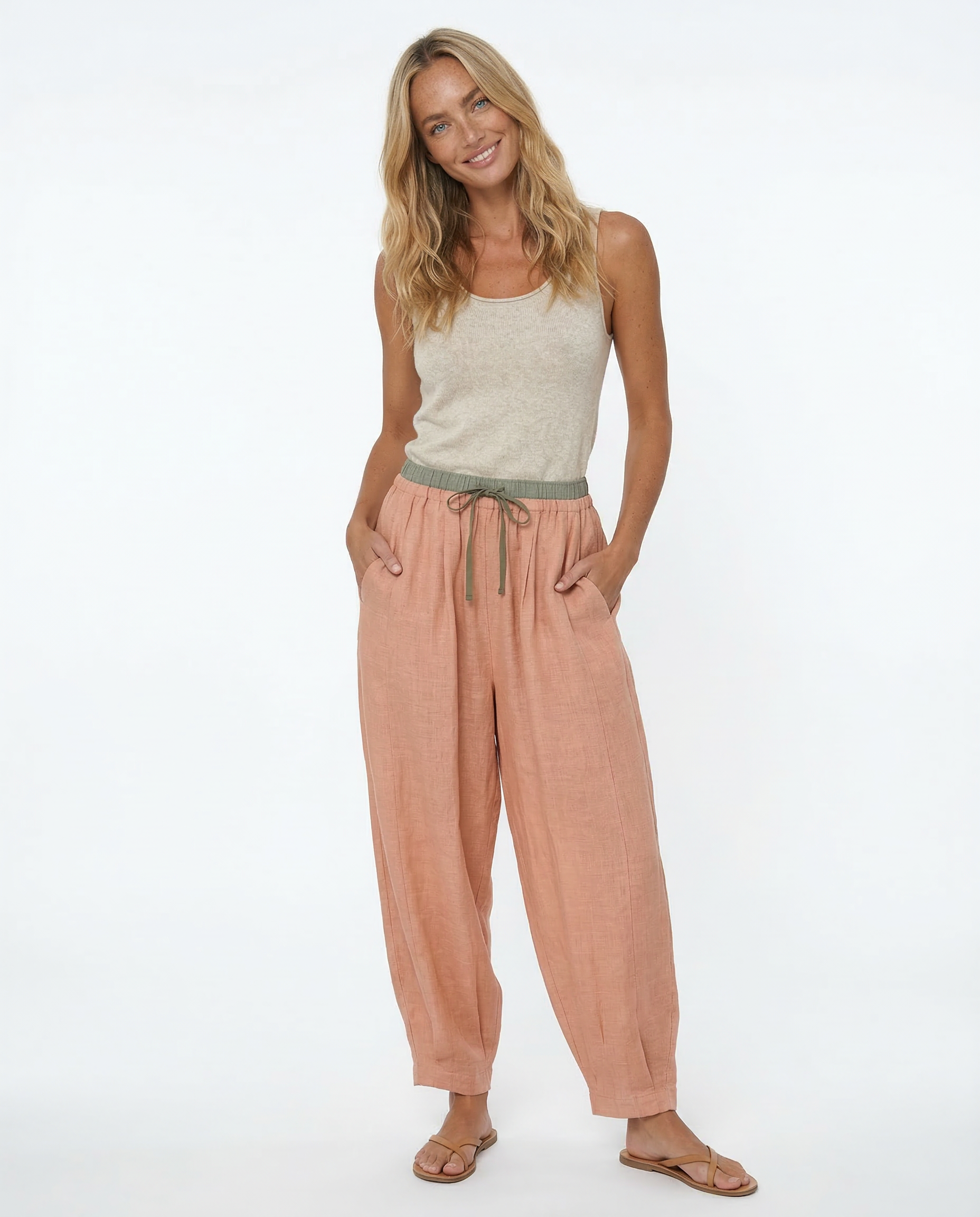Beige tapered linen trousers for women, loose pull-on style, comfortable casual pants, perfect for everyday wear.