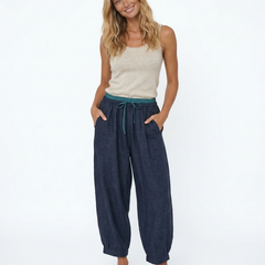 Beige tapered linen trousers for women with a loose, pull-on design, featuring a relaxed fit and comfortable style.