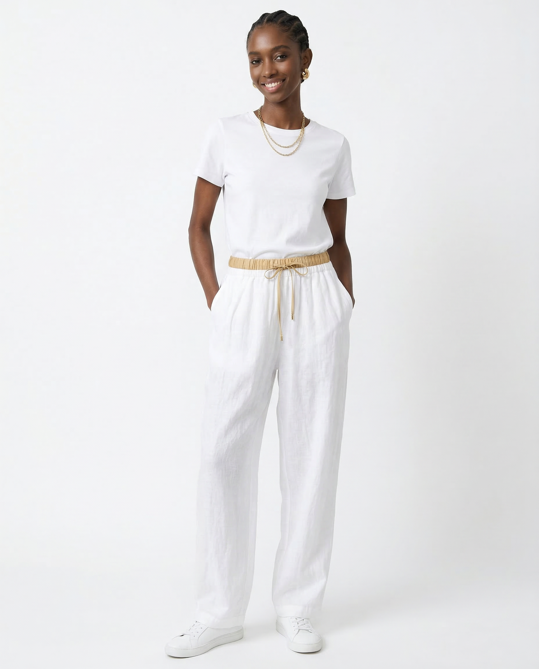 Beige tapered linen trousers for women, loose pull-on pants with a relaxed fit, stylish and comfortable for everyday wear.